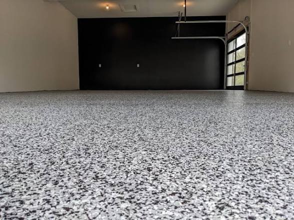 Gray and black speckled flake epoxy garage floor with black accent wall, Las Vegas NV